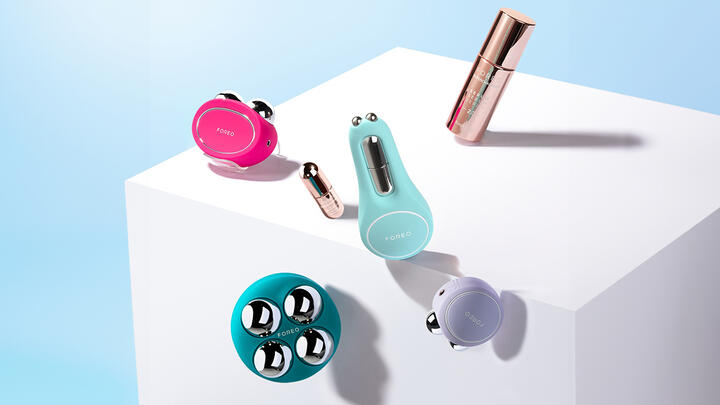 BEAR 2 collection questions answered FOREO BEAR 2, BEAR 2 body, BEAR 2 go, BEAR eyes&lips, SUPERCHARGED Serum, SUPERCHARGED Eye & Lip Contour Booster floating over a white cube on a light blue background
